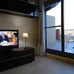 Bonito Atico con aire acondicionado,piscina comunitaria, Parking y WIFI