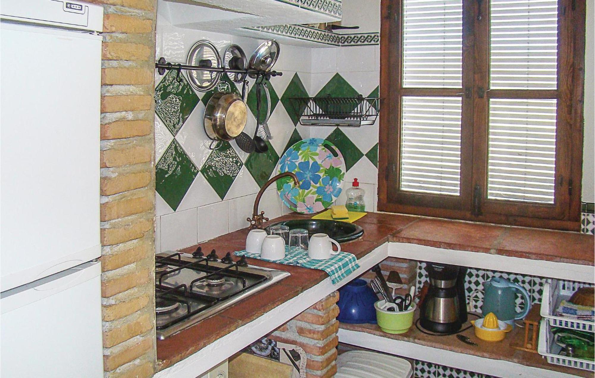 Сasa de vacaciones Cozy In El With Kitchen