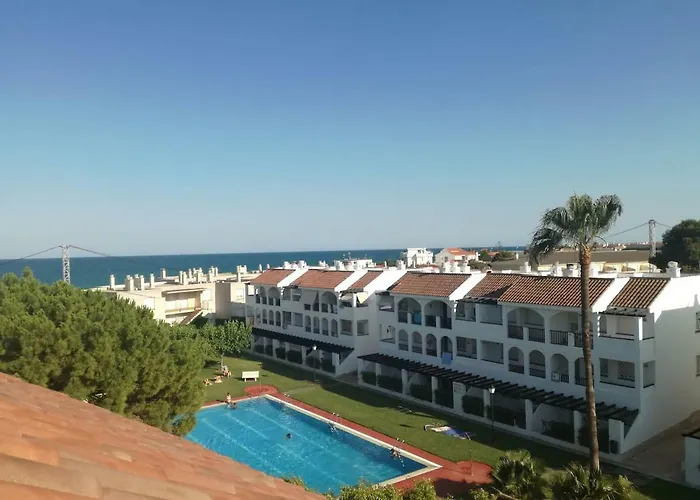 Apartamento con terraza privada y piscinas