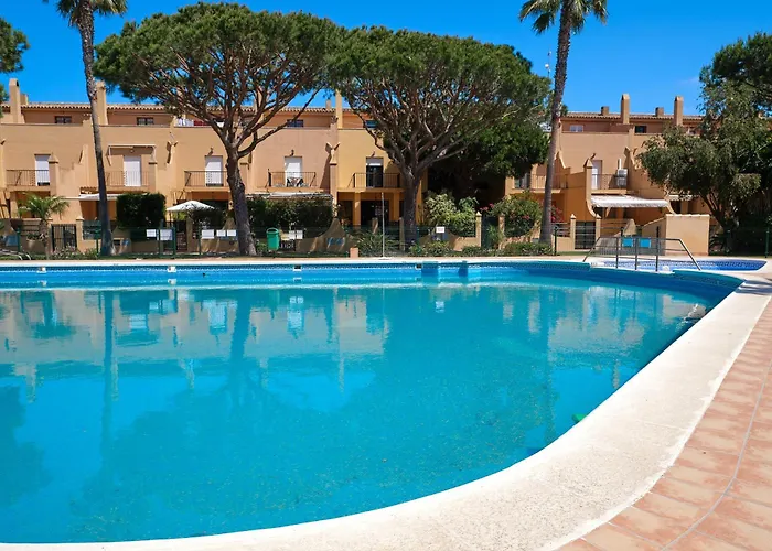 Adosado con jardín y piscina en Chiclana Barrosa-Sancti Petri